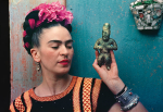 Nickolas Muray<br>
<em>Frida with Olmeca Figurine</em>, Coyoacán<br>
1939, Carbon process print