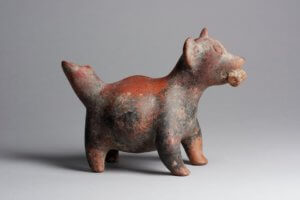 Comala style standing dog vessel with ear of corn in mouth